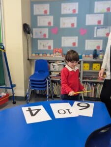 Learning through play, Kindergarten students learning numbers in a fun way.